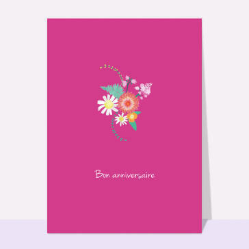 Bon anniversaire et fleurs sur fond rose