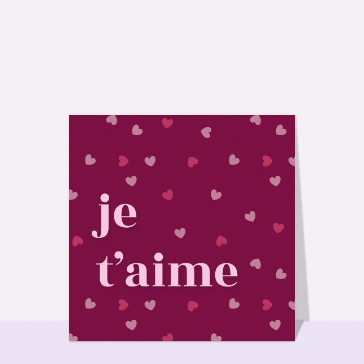 Carte Je t`aime sur fond de petits coeurs bordeau