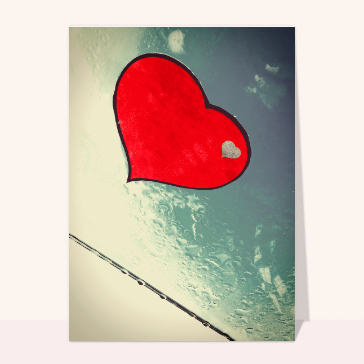 Coeur sur une vitre mouillée